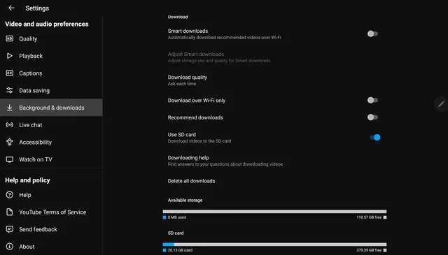 A dark mode screenshot of the YouTube app settings menu open to the "Background & downloads" tab, displaying download quality preferences and showing the "Use SD card" option toggled on alongside available storage details.